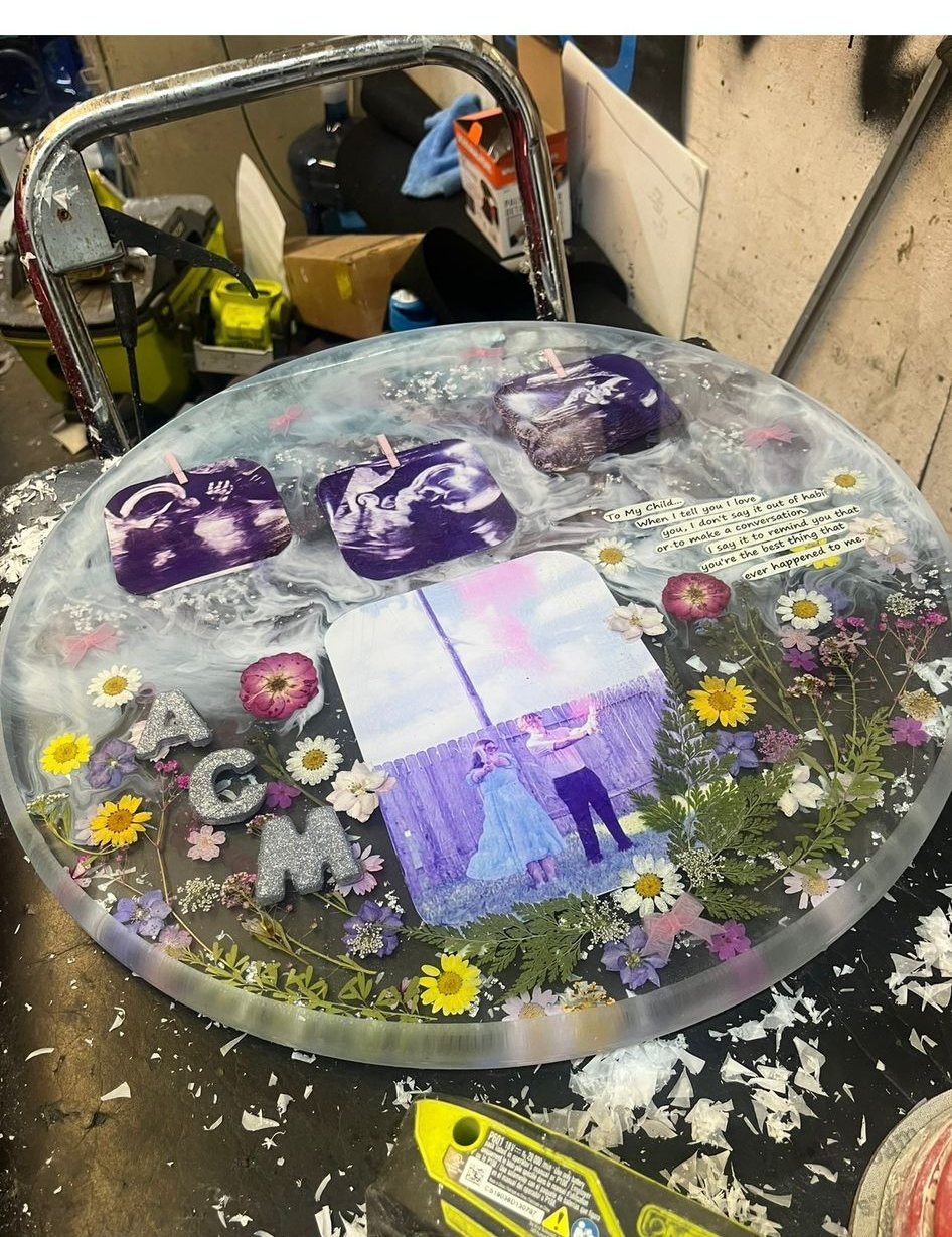 Round keepsake table with wedding photo, sonograms and pressed flowers in resin